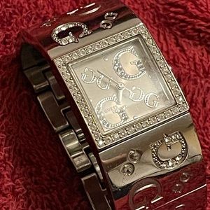 Stainless steel Guess cuff watch with rhinestones.